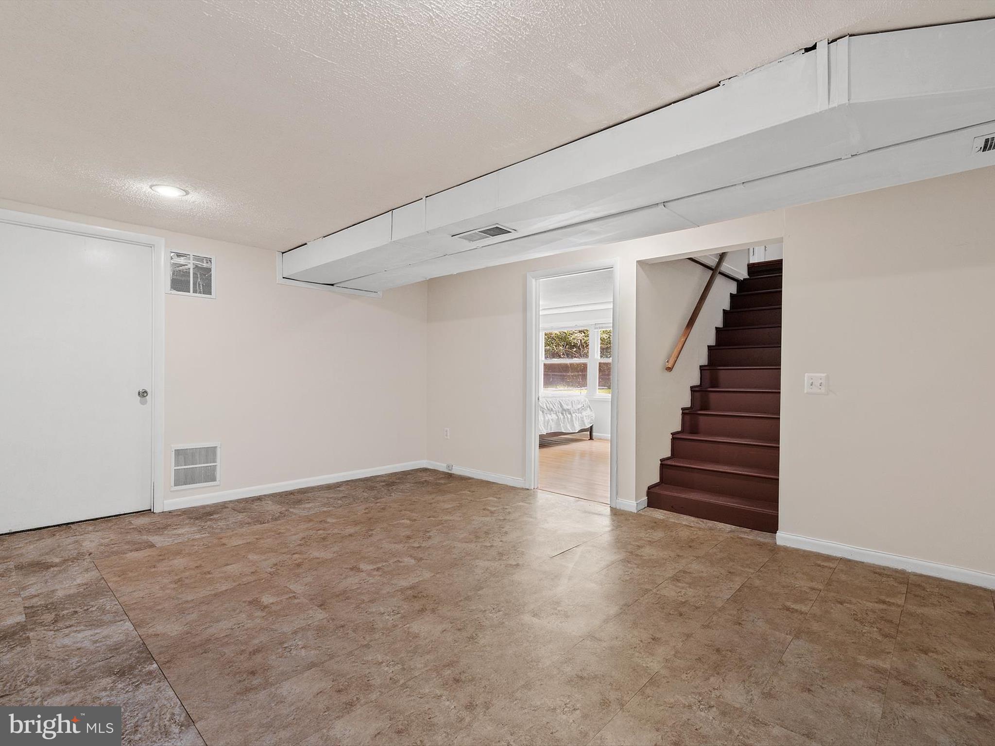 10525 Edgemont Drive Adelphi, MD 20783 - Photo 20 of 36 a view of an empty room with stairs