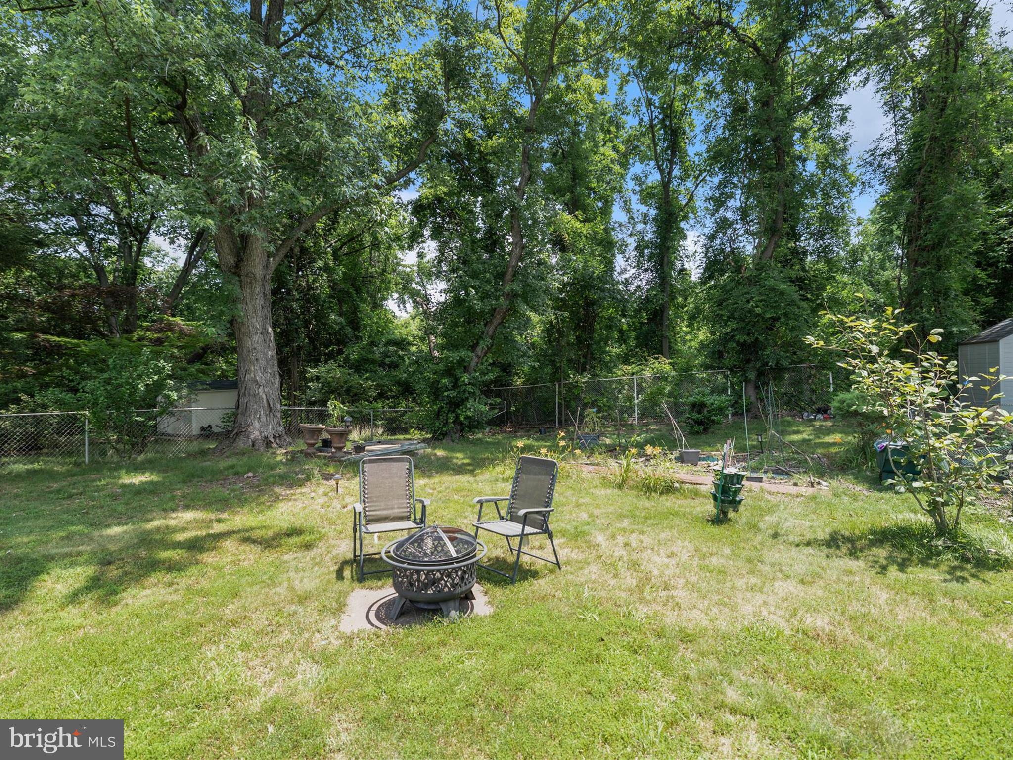 10525 Edgemont Drive Adelphi, MD 20783 - Photo 32 of 36 a view of a lake with a table and chairs