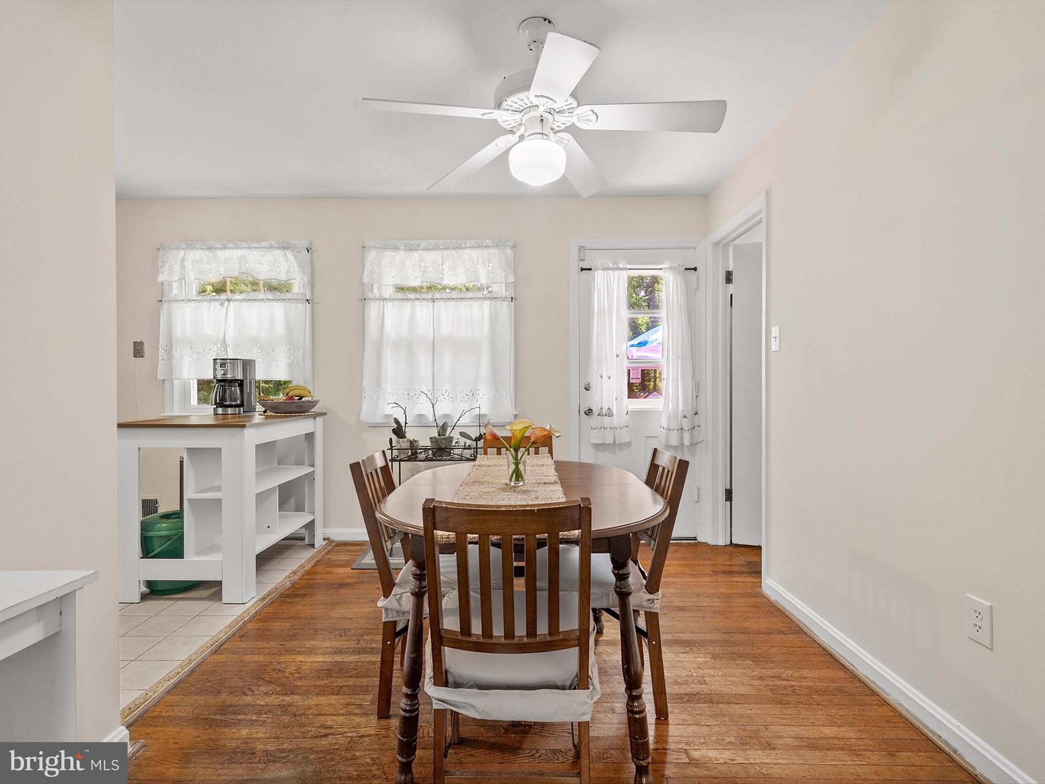 10525 Edgemont Drive Adelphi, MD 20783 - Photo 7 of 36 a view of a dining room with furniture and wooden floor