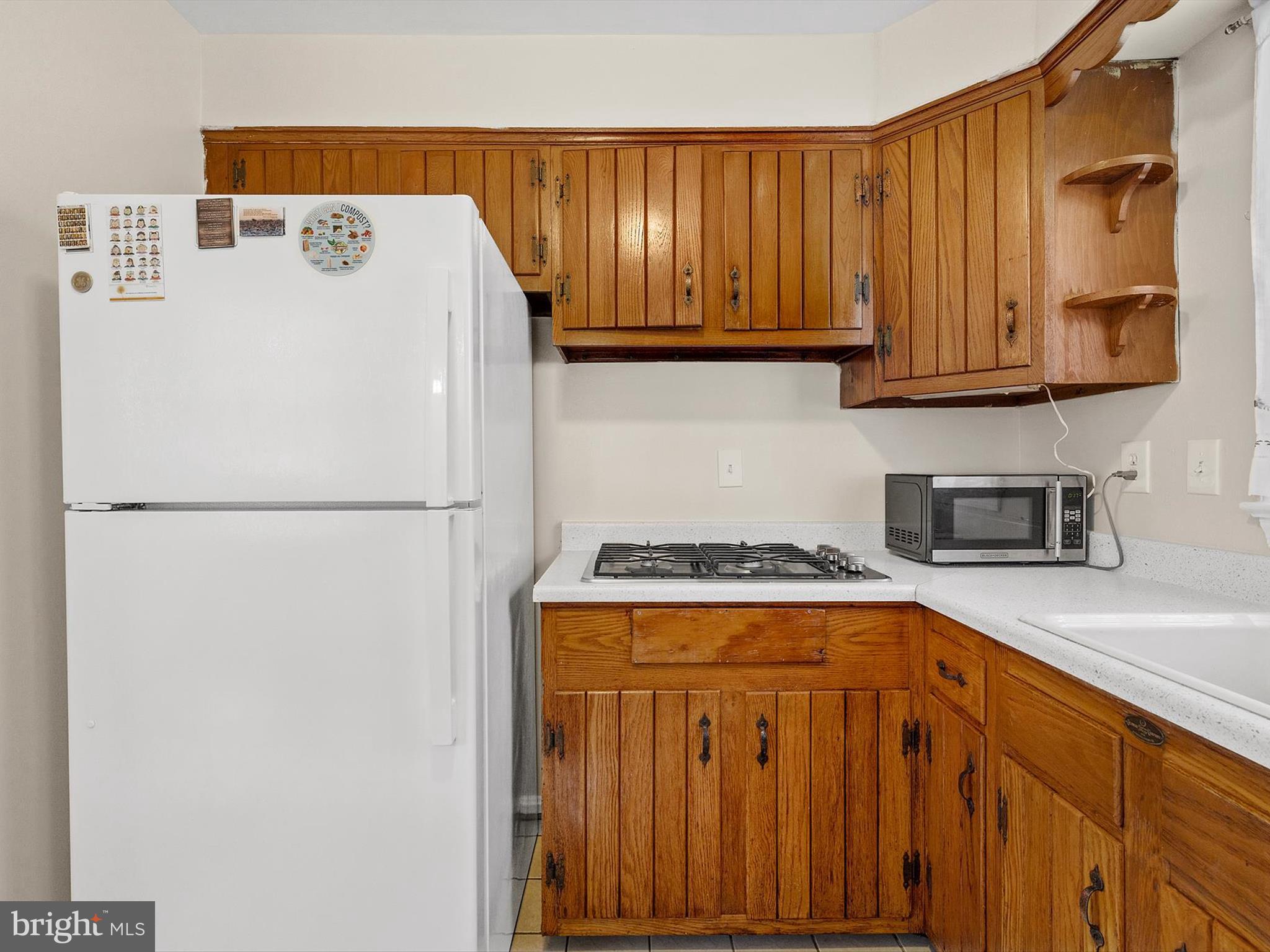 10525 Edgemont Drive Adelphi, MD 20783 - Photo 10 of 36 a white refrigerator freezer sitting in a kitchen