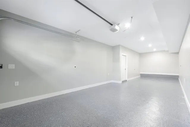 an empty room with a empty space and windows