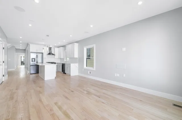 a view of kitchen with wooden floor