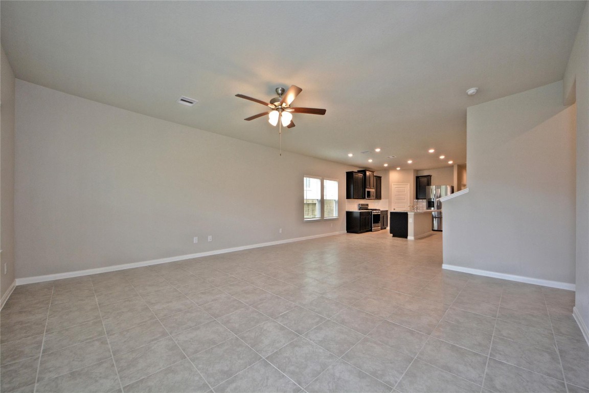 1015 Modesto Drive Rosharon, TX 77583 - Photo 12 of 37 Stunning view from the living space into the kitchen highlighting the open concept design that today’s buyers love! Perfect for hosting, relaxing, and making lasting memories. CALL NOW and make this home yours!