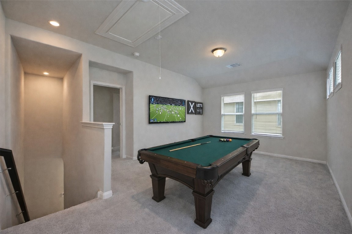 1015 Modesto Drive Rosharon, TX 77583 - Photo 25 of 37 Large upstairs game room featuring plush carpeting and multiple windows for natural light! This versatile space is perfect for a media room, play area, or second living space to fit your lifestyle. *Virtually Staged*