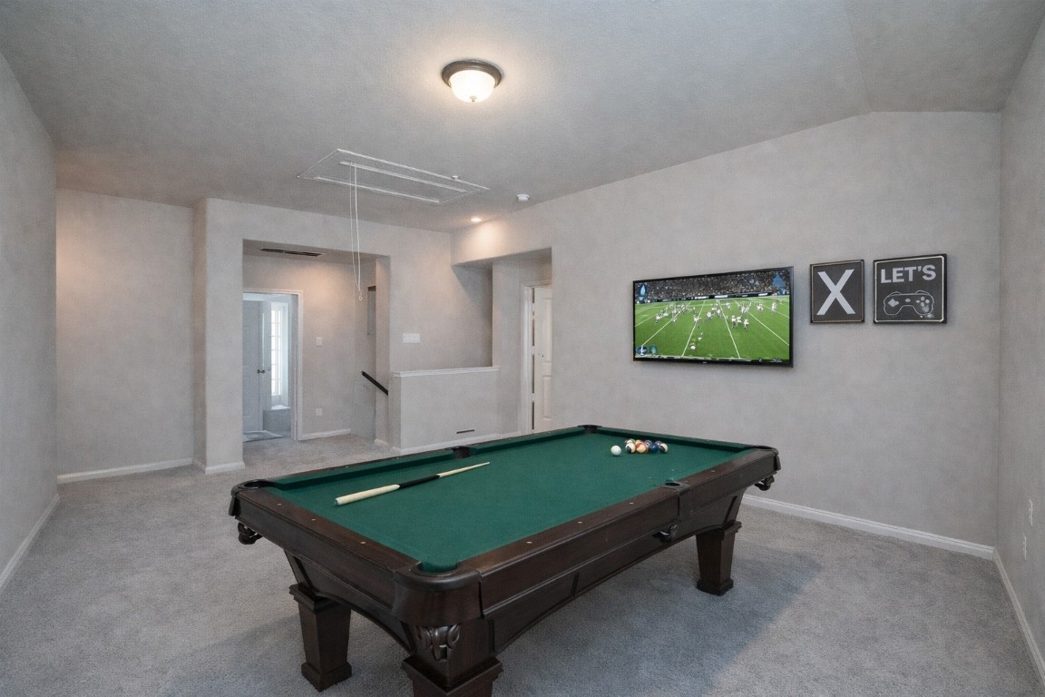 1015 Modesto Drive Rosharon, TX 77583 - Photo 26 of 37 Another view of the expansive game room showcasing its open layout and flexibility! Plenty of room for entertaining, hobbies, or a private retreat upstairs. *Virtually Staged*