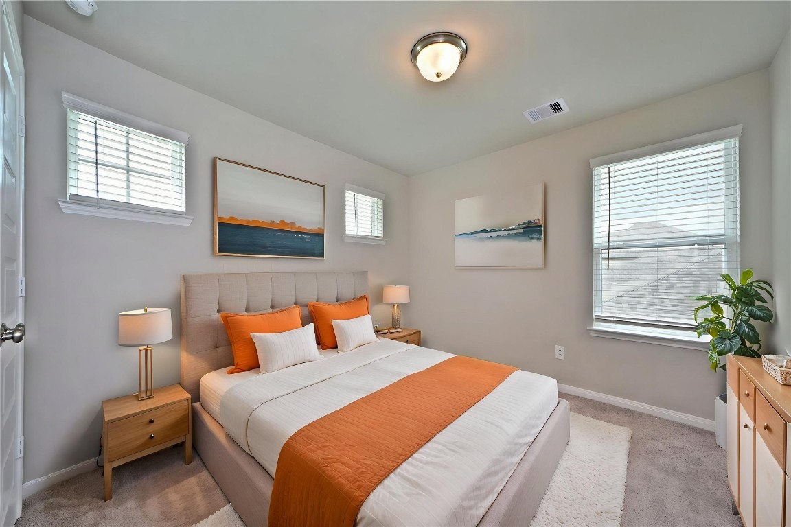 1015 Modesto Drive Rosharon, TX 77583 - Photo 28 of 37 Bright and comfortable guest bedroom featuring plush carpeting, large window, and plenty of natural light! A perfect space for family, guests, or even a secondary office. *Virtually Staged*