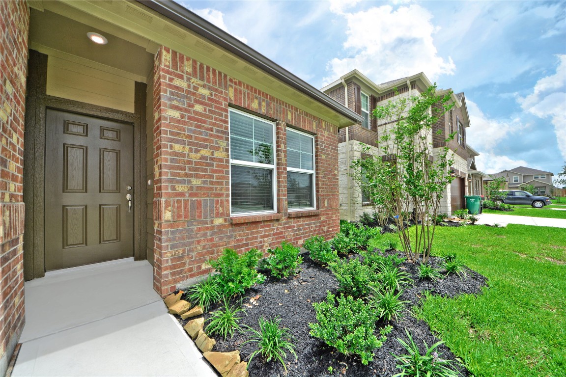 1015 Modesto Drive Rosharon, TX 77583 - Photo 3 of 37 Beautiful curb appeal welcomes you with a well maintained front yard, lush landscaping, and a cozy covered entry! This inviting exterior sets the tone for the warmth and comfort found throughout the home. A true place to call home, CALL NOW to see it in person!