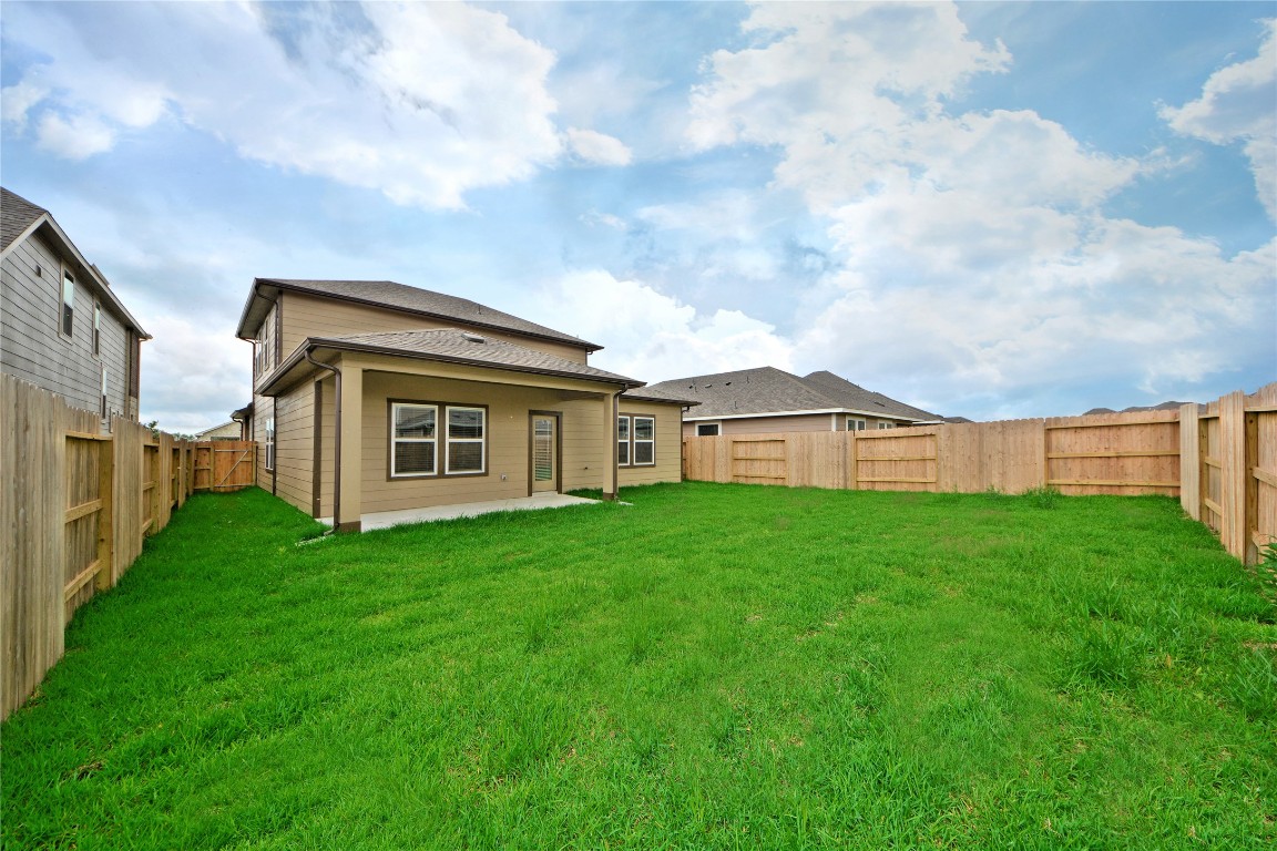 1015 Modesto Drive Rosharon, TX 77583 - Photo 33 of 37 Another view of the large backyard showcasing endless possibilities for outdoor living! Whether relaxing evenings or weekend gatherings, this space is ready for it all. CALL NOW and make this home yours!