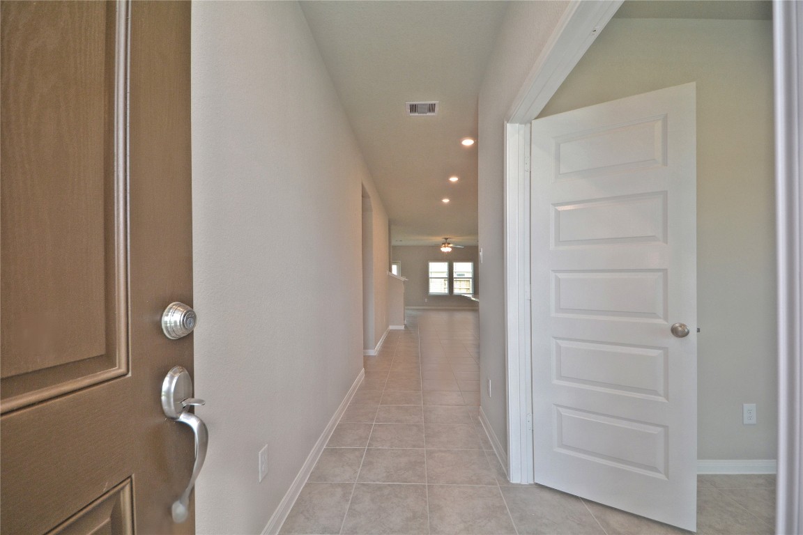 1015 Modesto Drive Rosharon, TX 77583 - Photo 4 of 37 Step inside and be greeted by a bright and inviting entryway that opens into a spacious layout filled with natural light! Clean lines, neutral tones, and tile flooring create the perfect canvas to make this space your own. Start creating your memories here today!