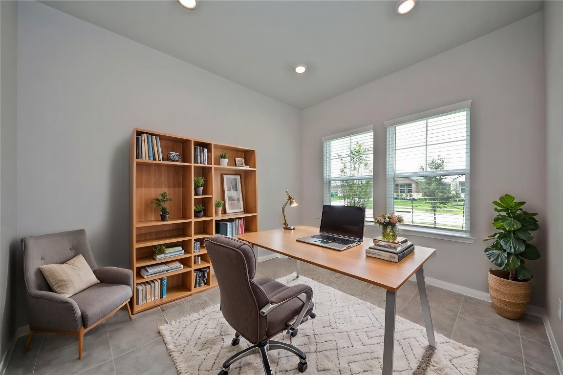 1015 Modesto Drive Rosharon, TX 77583 - Photo 5 of 37 Dedicated private study with large windows bringing in abundant natural light, creating the perfect work from home environment! This bright and comfortable space offers flexibility for a home office, reading room, or creative studio. A must have feature for today’s lifestyle, make this home yours! *Virtually Staged* HOME VACANT AND READY FOR YOUR MEMORIES!