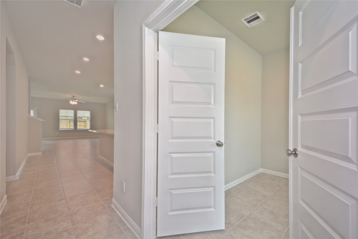 1015 Modesto Drive Rosharon, TX 77583 - Photo 6 of 37 Another view of the interior layout showcasing the seamless flow and thoughtful design of the home! Generous spaces, bright finishes, and multiple layout options make this home ideal for both everyday living and entertaining. Don’t miss this opportunity, CALL NOW!