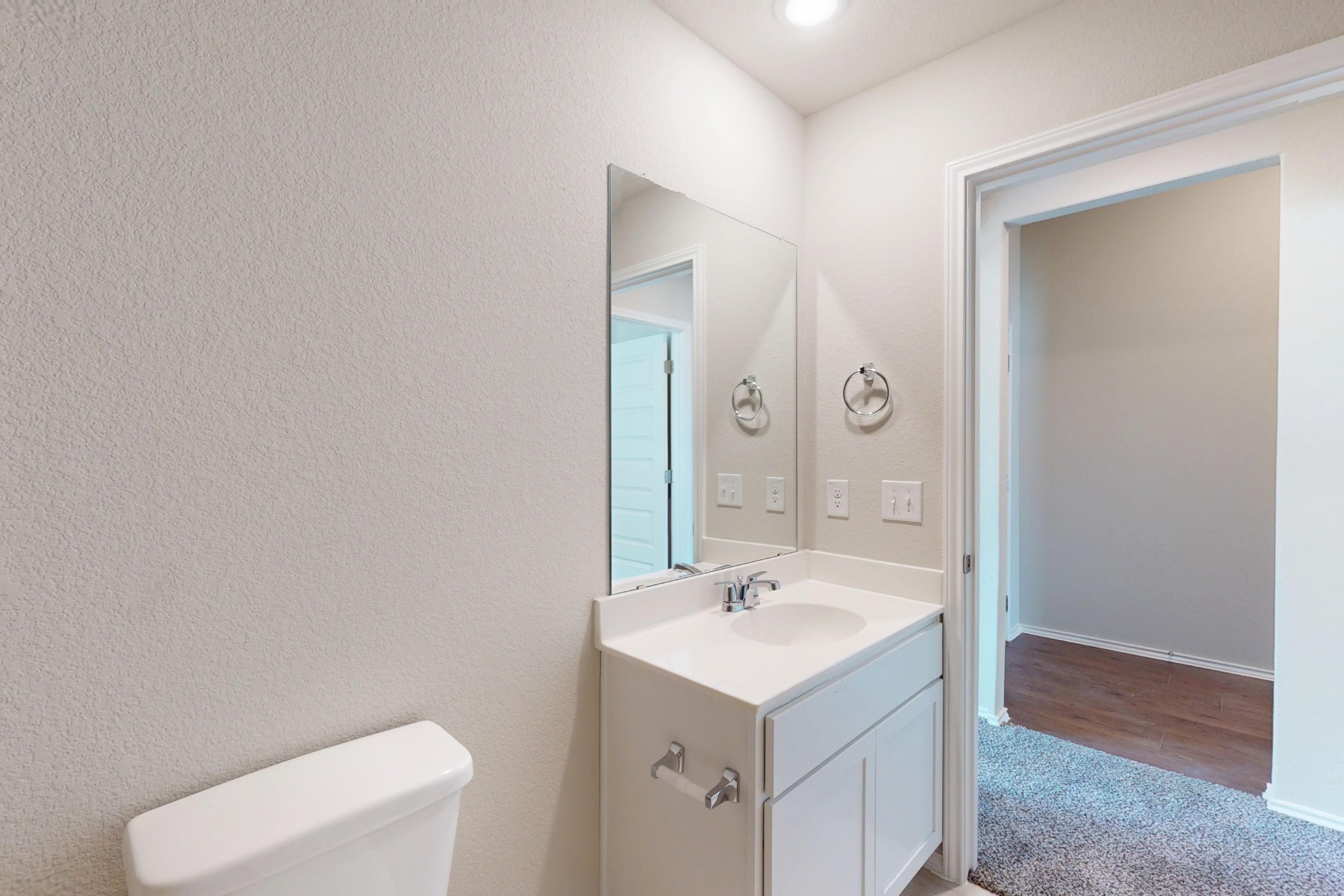 9200 Corvallis Drive Austin, TX 78747 - Photo 23 of 33 a bathroom with a sink a toilet and mirror