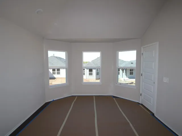 a view of an empty room with windows