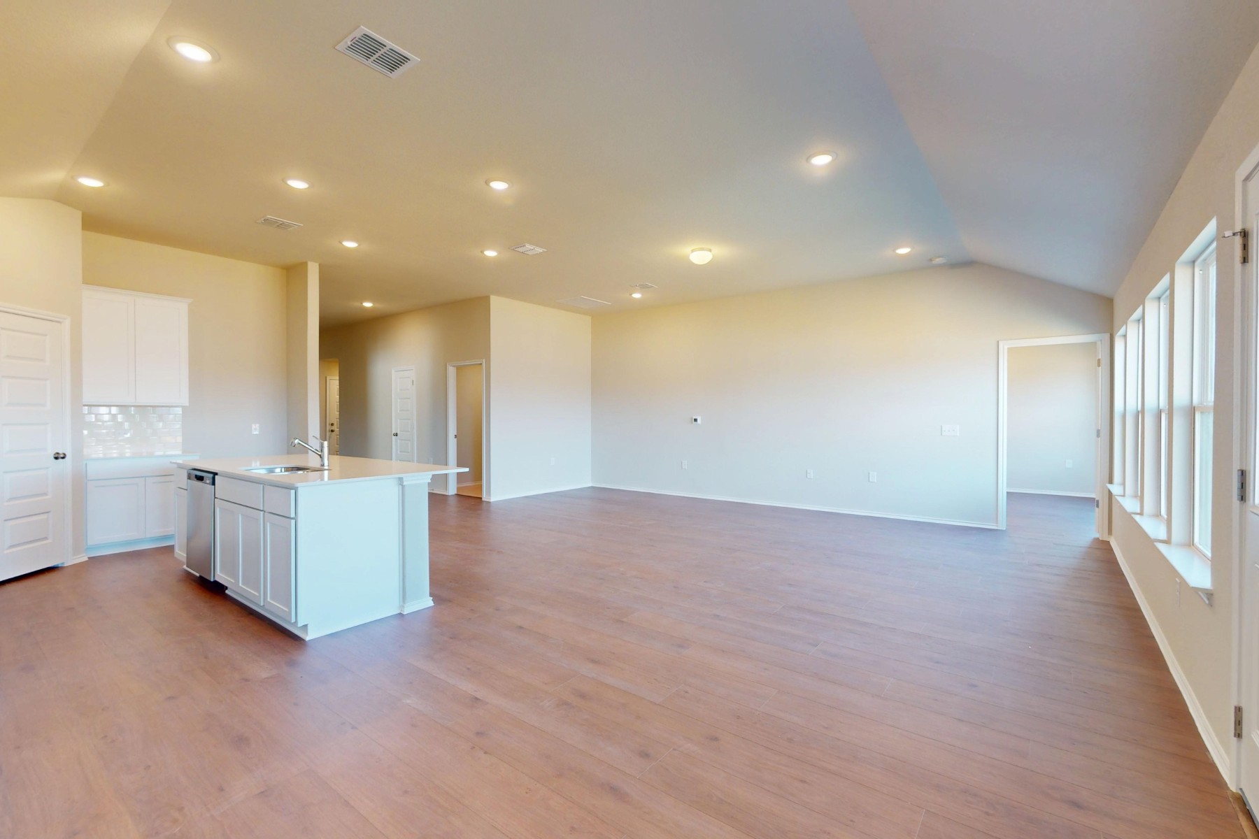 9200 Corvallis Drive Austin, TX 78747 - Photo 8 of 33 a view of an empty room with kitchen and window