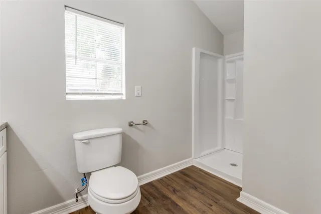 a view of a pool with a backyard