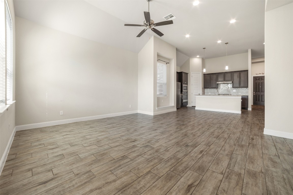 2229 Base Burner Path Leander, TX 78641 - Photo 11 of 40 a view of a kitchen with a sink and a refrigerator