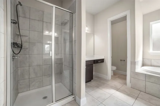 a bathroom with a shower and a sink