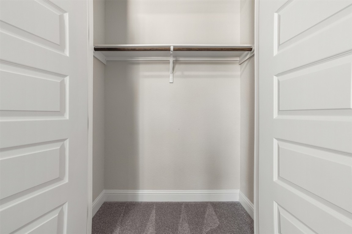 2229 Base Burner Path Leander, TX 78641 - Photo 30 of 40 a view of walk in closet with empty racks