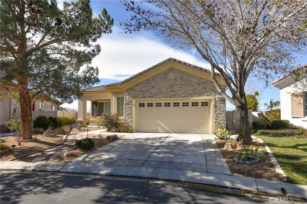 19250 Galloping Hill Road Apple Valley, CA 92308 - Photo 1 of 1 a front view of house with yard outdoor seating and covered with green space