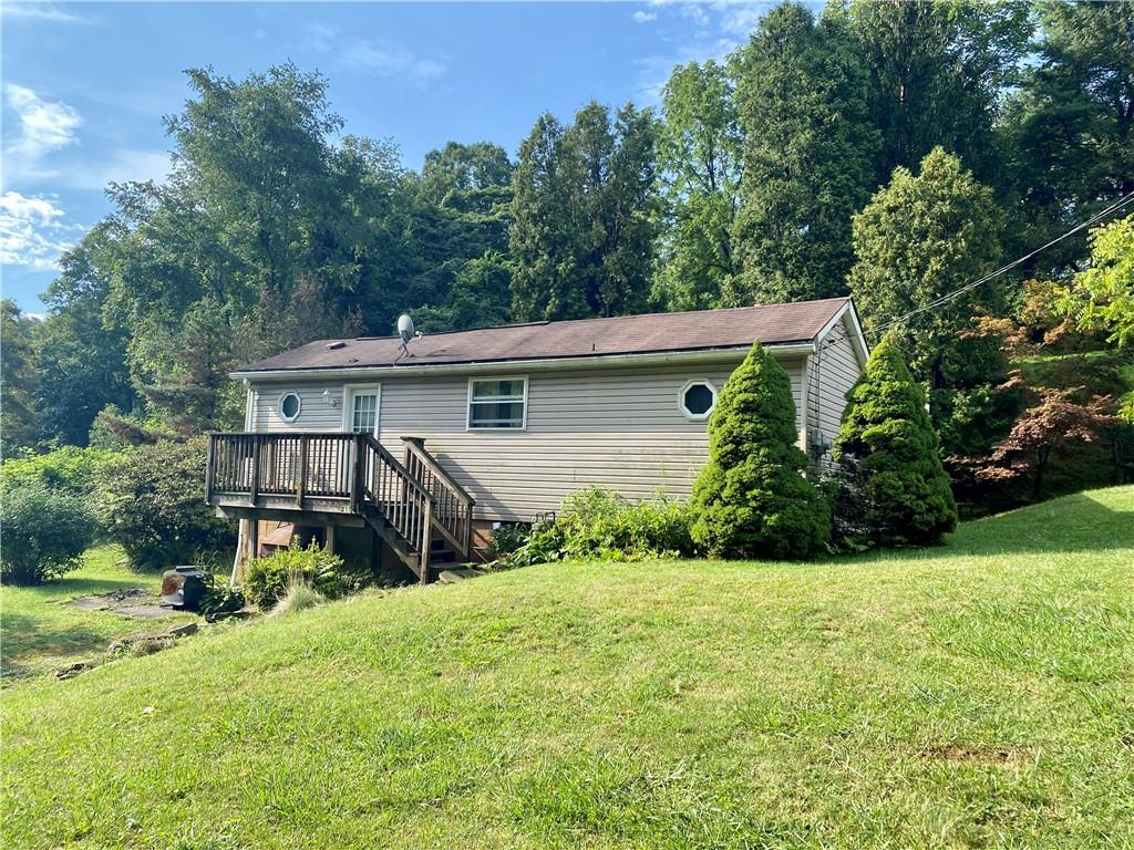 211 Amsler Road Sewickley, PA 15143 - Photo 1 of 18 a view of a house with backyard and sitting area