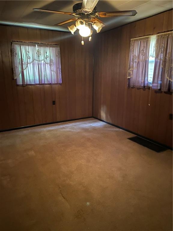 211 Amsler Road Sewickley, PA 15143 - Photo 11 of 18 an empty room with windows and ceiling fan