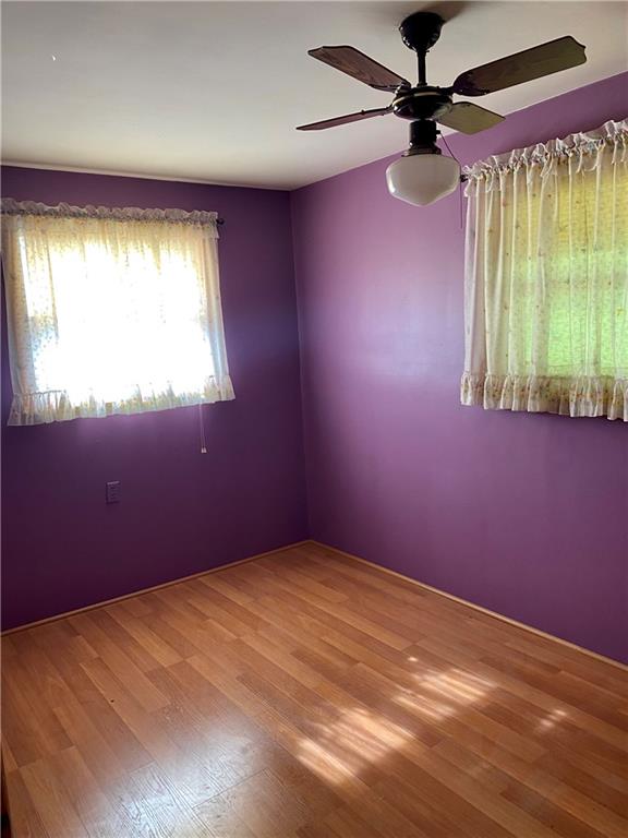 211 Amsler Road Sewickley, PA 15143 - Photo 13 of 18 an empty room with a window and a fan