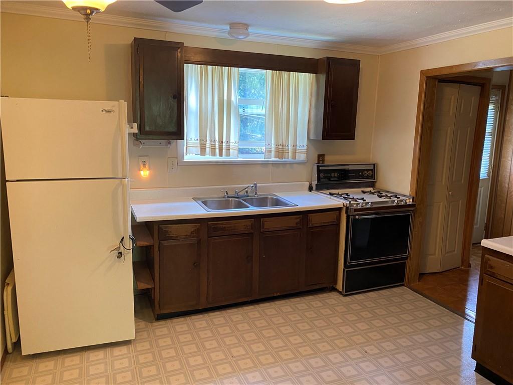 211 Amsler Road Sewickley, PA 15143 - Photo 7 of 18 a kitchen with a refrigerator stove and sink