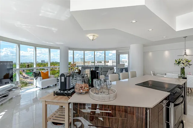 a view of a dining room with furniture large windows and wooden floor