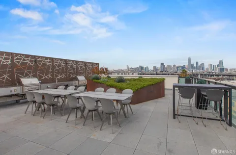 a view of a terrace with furniture and a potted plant