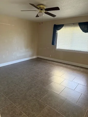 a view of an empty room with a window