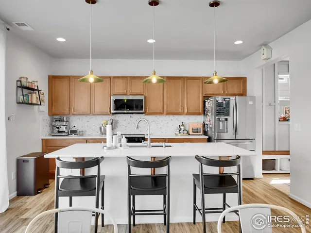 a living room with furniture a window and a fireplace