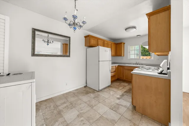 a room with a stove and a refrigerator