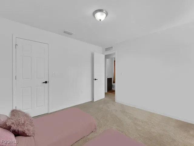 a view of an empty room and window