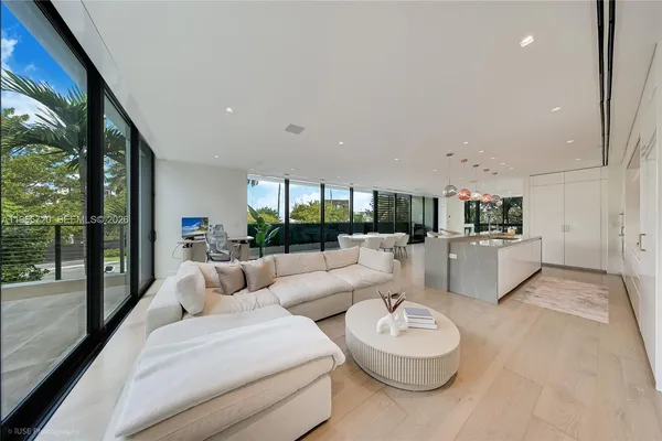 a large kitchen with a table and chairs