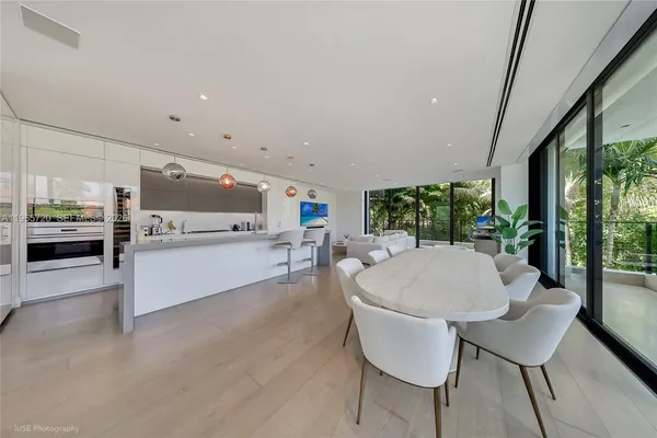 a view of a kitchen with a sink and cabinets