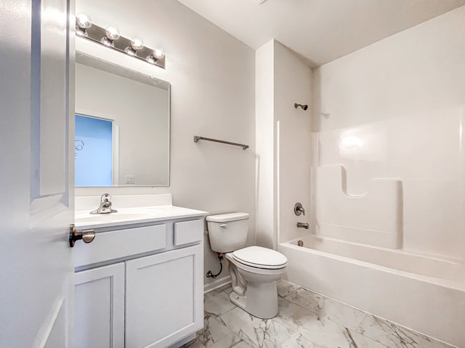 488 Ridge Road Bolingbrook, IL 60440 - Photo 11 of 16 a bathroom with a sink toilet and shower