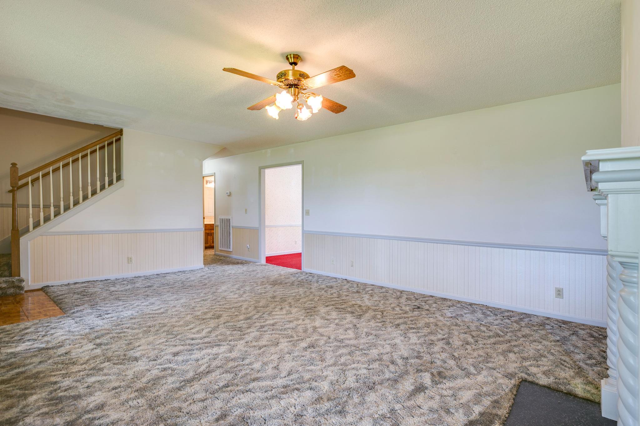 3596 Ridgefield Drive Murfreesboro, TN 37129 - Photo 5 of 24 Another view of the living room. Staircase off of living room leads to the large unfinished space.