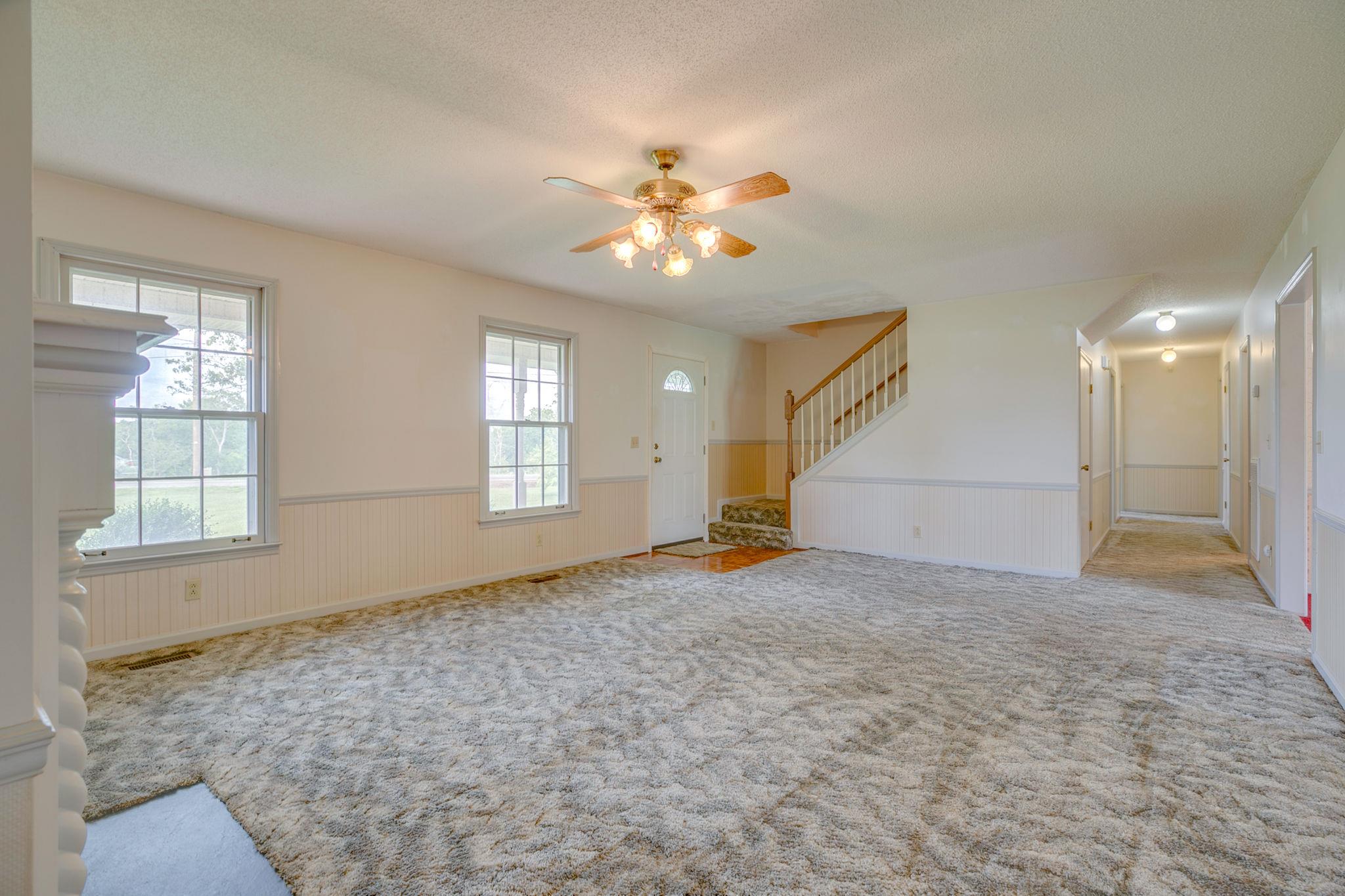 3596 Ridgefield Drive Murfreesboro, TN 37129 - Photo 6 of 24 Living room with hallway leading to downstairs bedrooms.