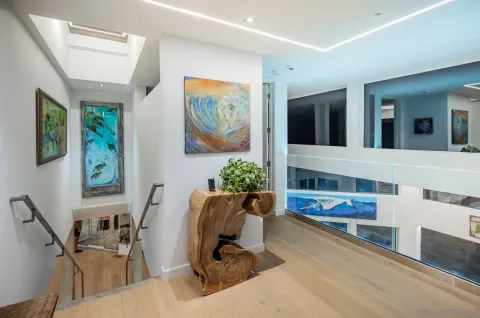 a bedroom with furniture and a large window