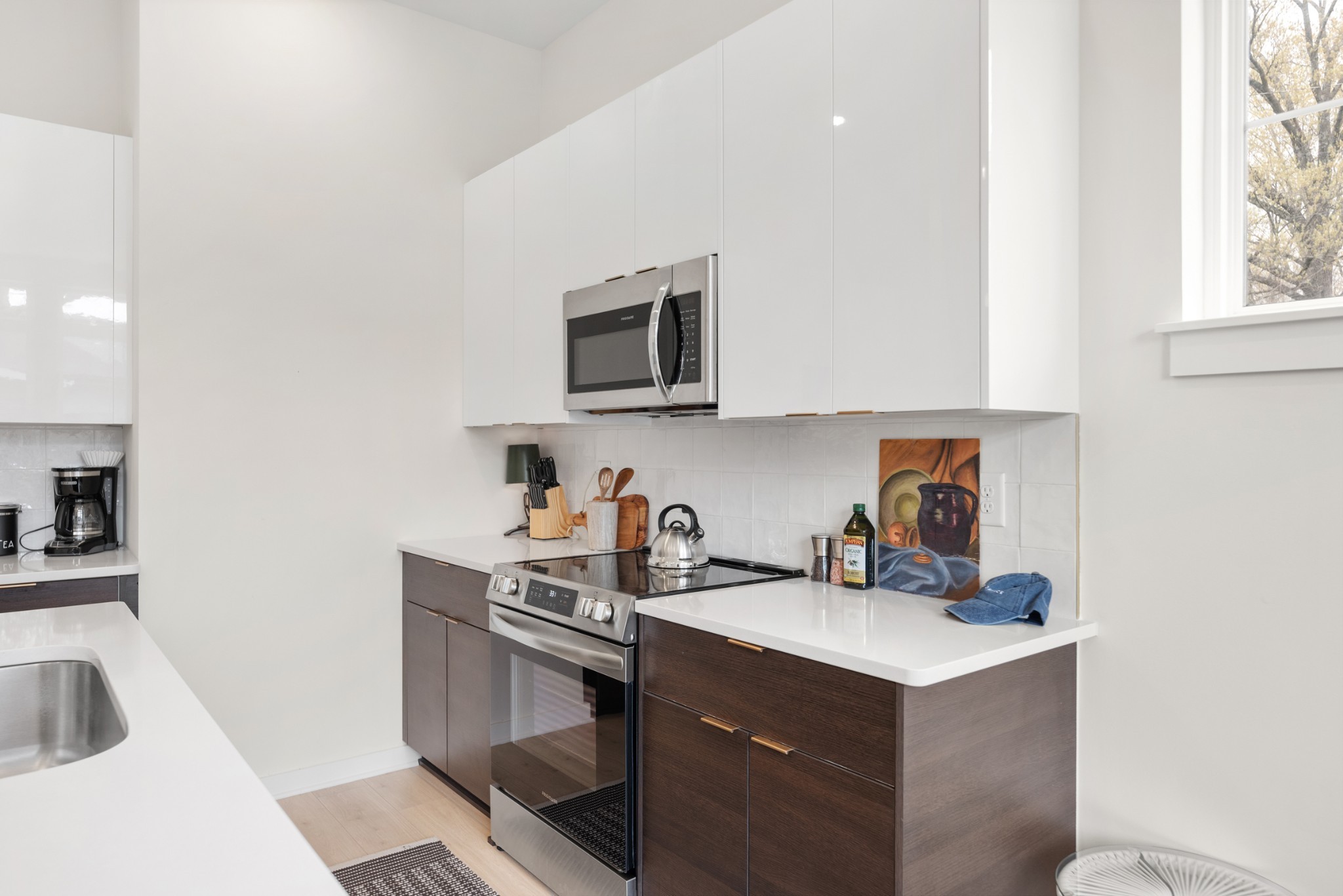 1233 Lischey Avenue, Unit D Nashville, TN 37207 - Photo 11 of 31 a kitchen with a sink cabinets and a microwave oven