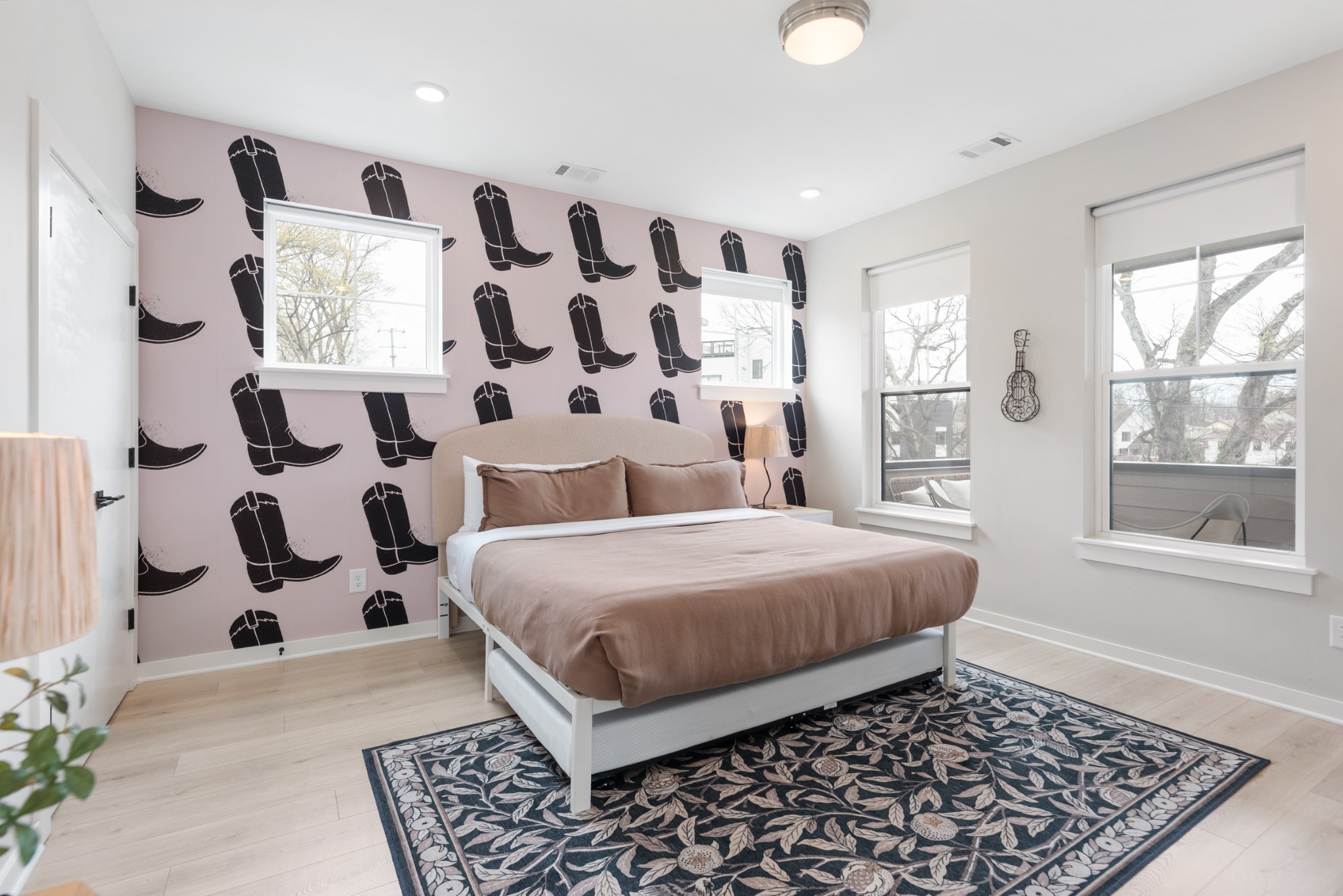 1233 Lischey Avenue, Unit D Nashville, TN 37207 - Photo 22 of 31 a bedroom with a bed and wooden floor