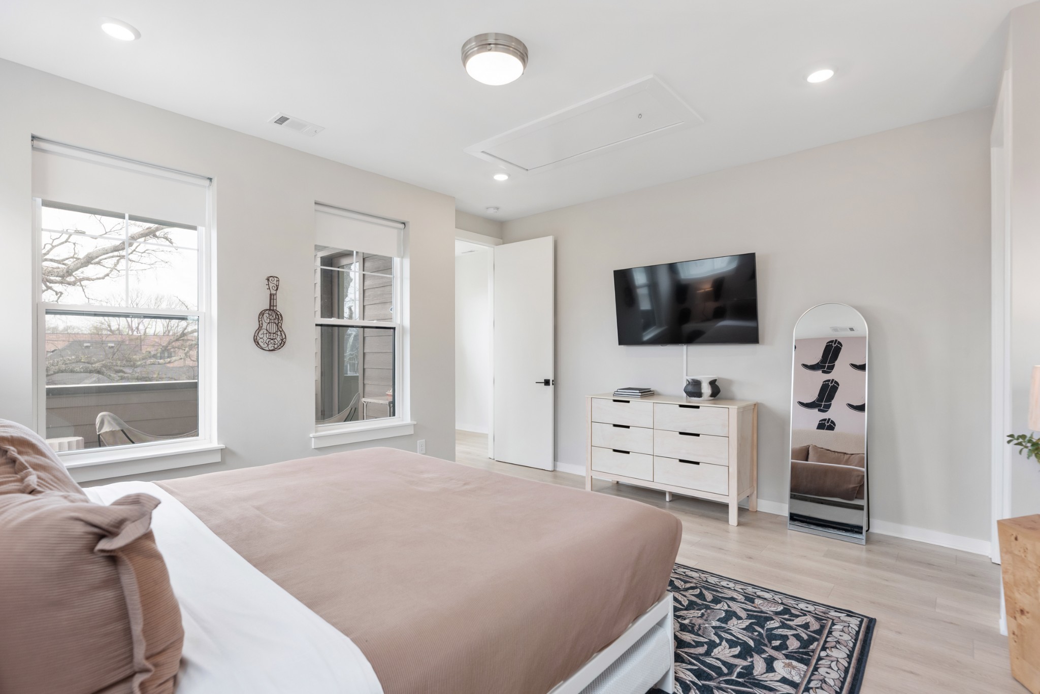 1233 Lischey Avenue, Unit D Nashville, TN 37207 - Photo 23 of 31 a bedroom with a bed and a flat screen tv