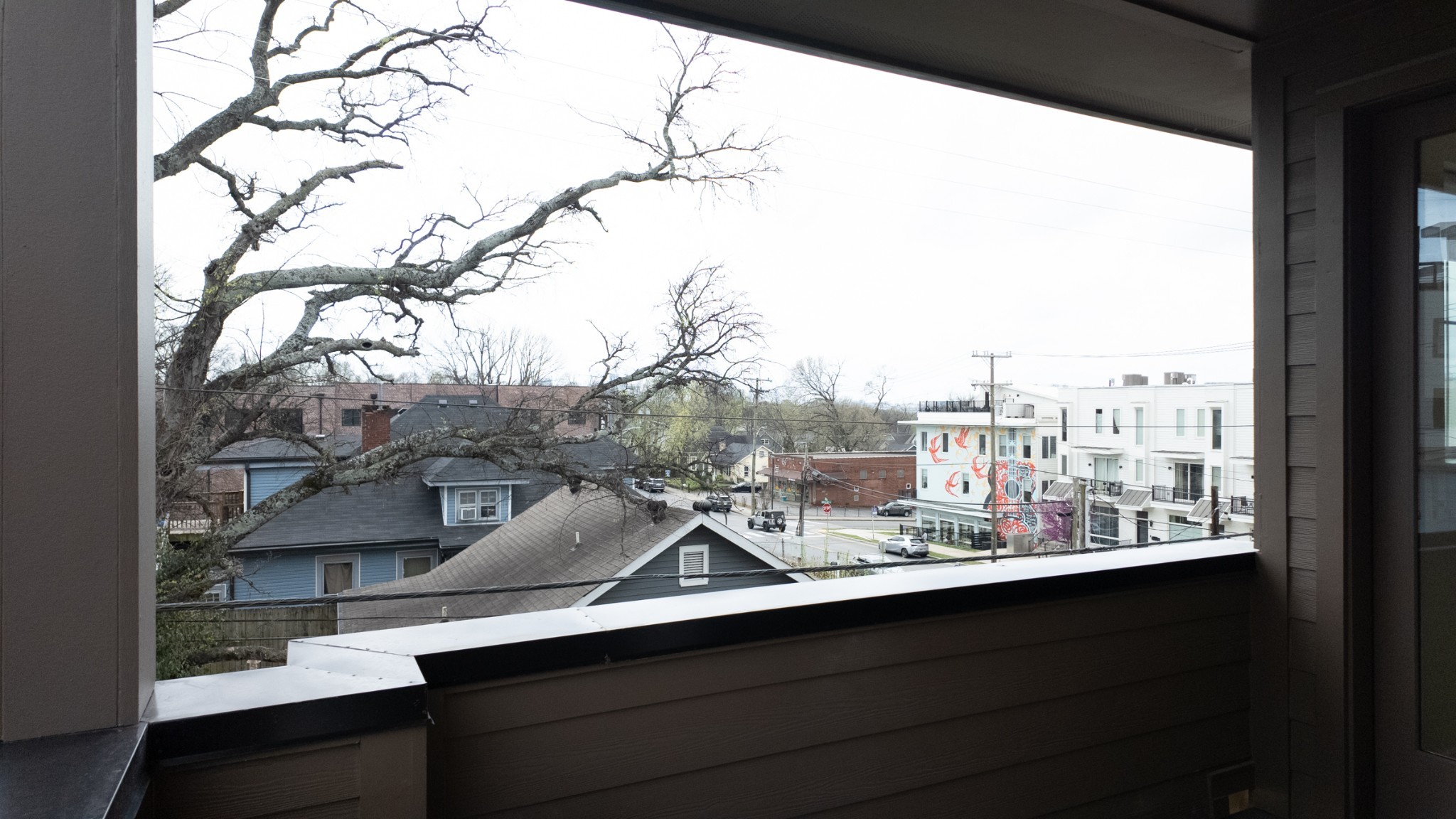 1233 Lischey Avenue, Unit D Nashville, TN 37207 - Photo 28 of 31 a view of a balcony with trees