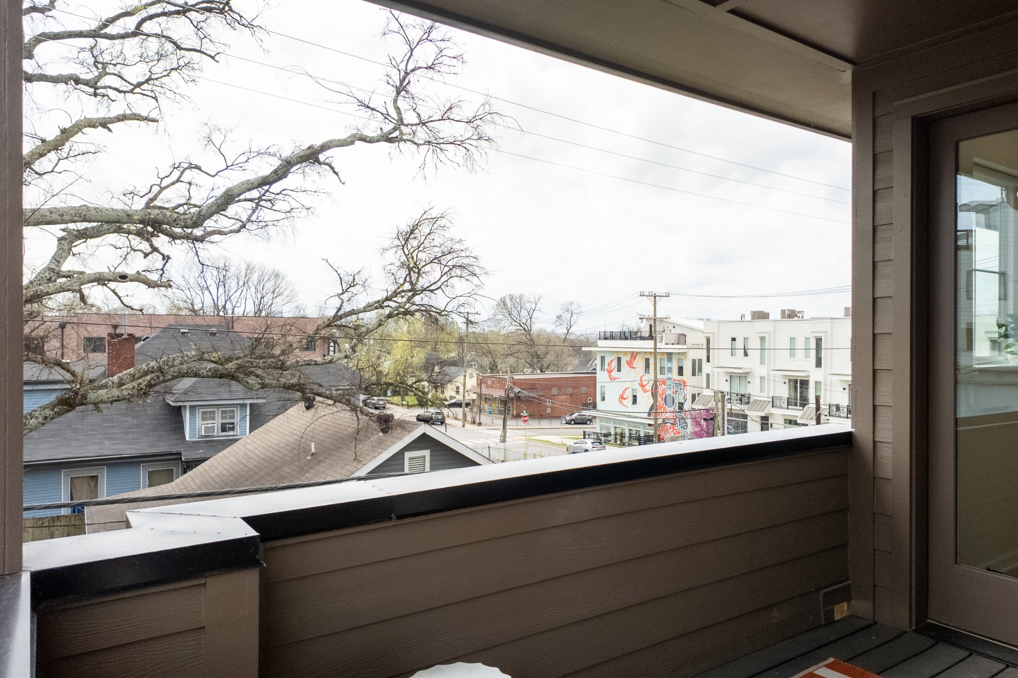1233 Lischey Avenue, Unit D Nashville, TN 37207 - Photo 29 of 31 a view of a city from a balcony with seating space