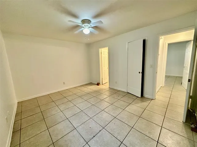 a kitchen with cabinets a sink and white appliances