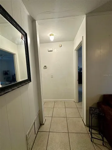 a bathroom with a glass door shower a sink and a mirror