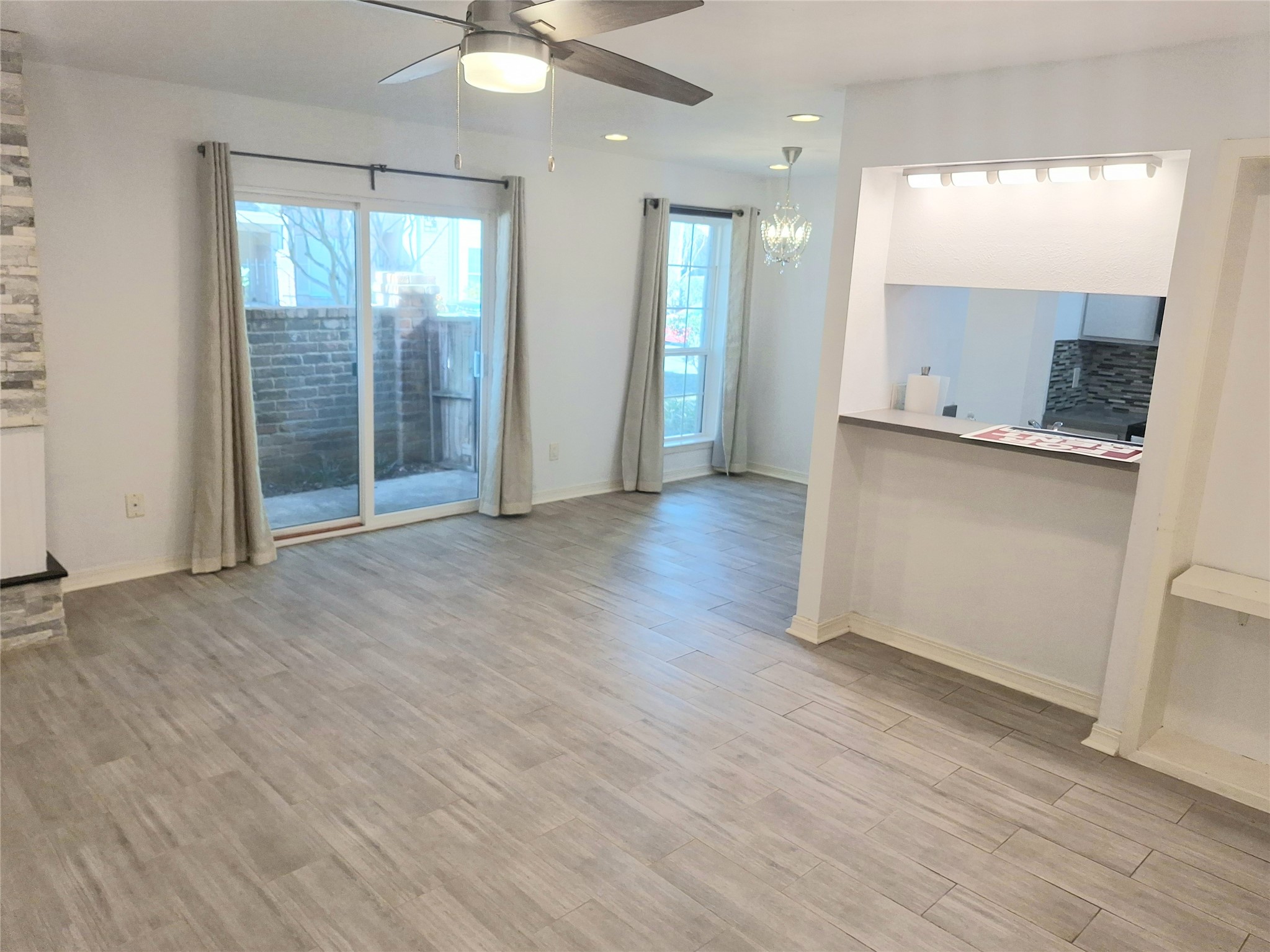 2800 Jeanetta Street, Unit 801 Houston, TX 77063 - Photo 1 of 18 an empty room with wooden floor and windows