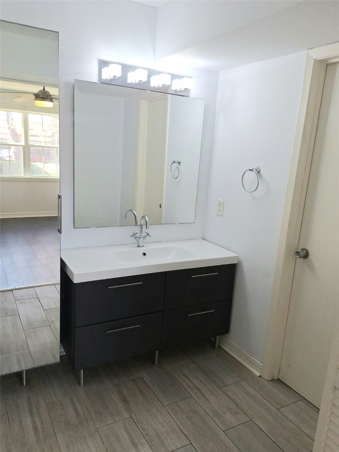 2800 Jeanetta Street, Unit 801 Houston, TX 77063 - Photo 12 of 18 a bathroom with a sink vanity and a mirror