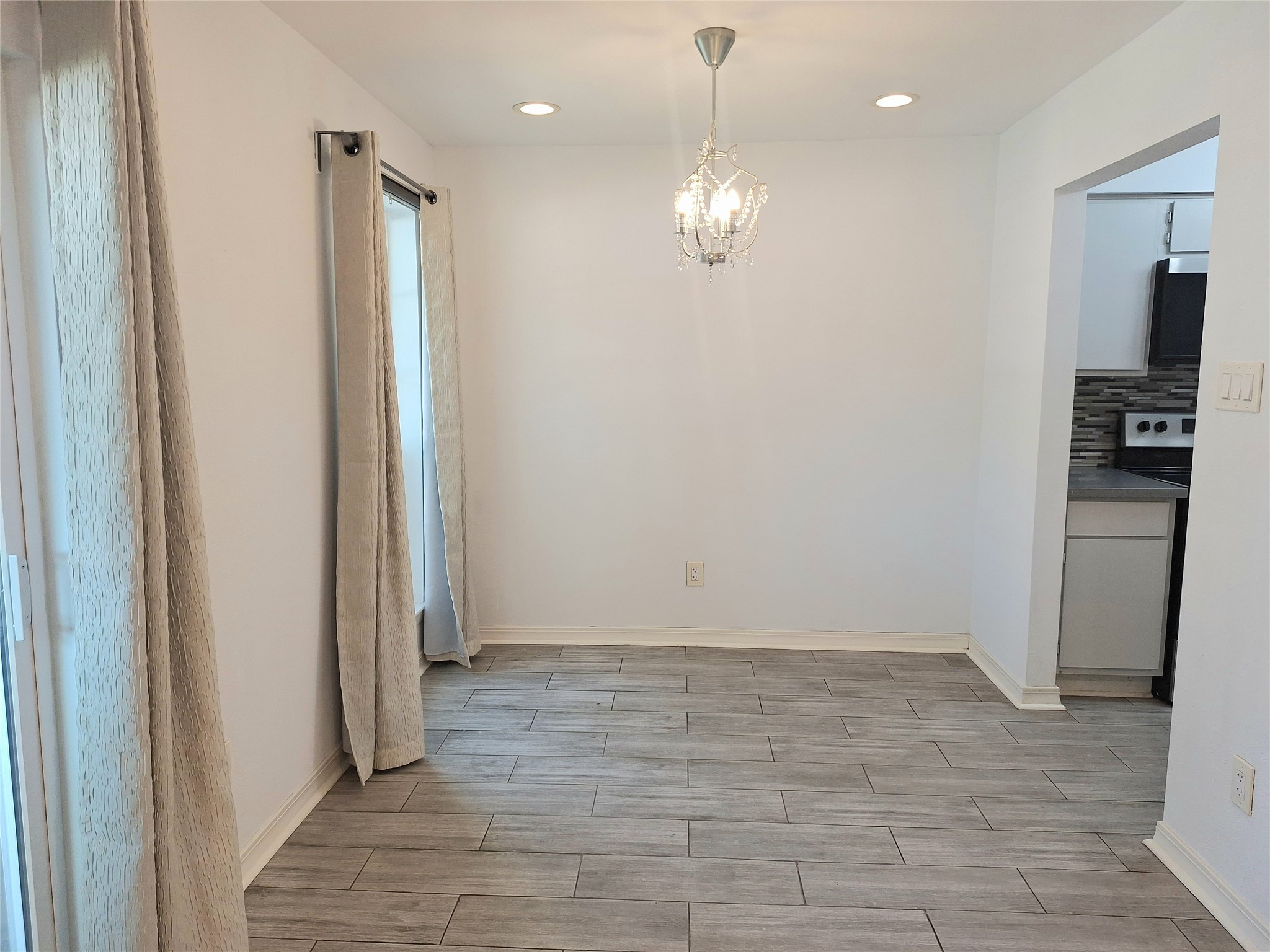 2800 Jeanetta Street, Unit 801 Houston, TX 77063 - Photo 5 of 18 an empty room with kitchen view