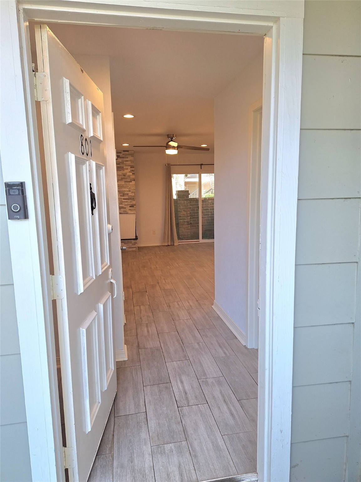 2800 Jeanetta Street, Unit 801 Houston, TX 77063 - Photo 8 of 18 a view of a hallway with wooden floor and a living room